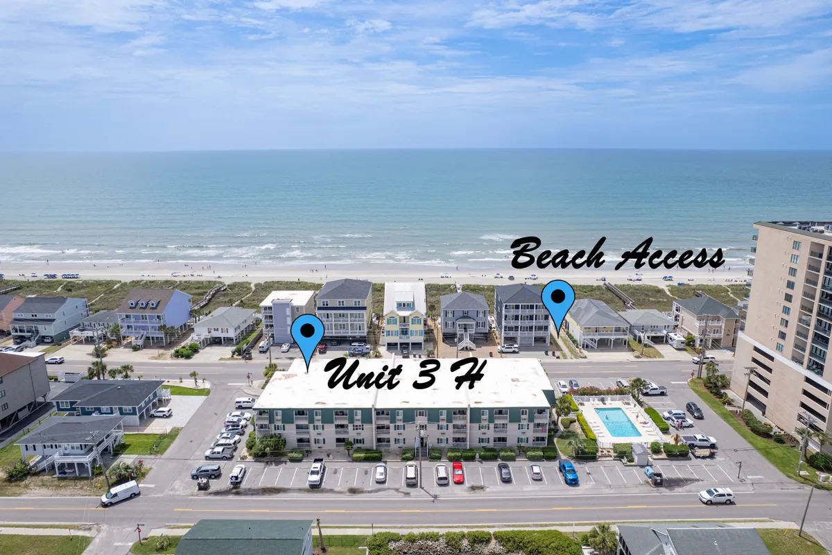 The image showcases the Surf Shack's entrance area, clearly marked with a beach access sign and visible Unit 3 H, alongside a view of the inviting pool area. The pool sparkles in the sun, and the sign indicates immediate proximity to the beach, establishing the property’s easy access to both amenities.